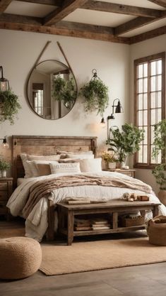 a bedroom with a bed, mirror and potted plants