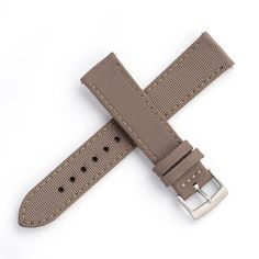 Crafted from durable sailcloth canvas with a leather underside, it is the ideal choice for outdoor enthusiasts or anyone looking for a strap that can withstand the rigors of daily wear. The leather ensures optimal comfort with its smooth texture and soft feel against the skin. Installation is easy thanks to the built-in quick release spring bars. While it may be stiff initially, it should break-in for a snug fit after just a few wears. Color: Grey with tan stitchingMaterial: Sailcloth canvas top Leather Watch Bands For Outdoor, Brown Leather Watch Accessories For Outdoor, Adjustable Leather Watch Bands For Outdoor, Outdoor Brown Leather Watch Accessories, Durable Brown Watch Accessories For Outdoor, Brown Leather Outdoor Watch Accessories, Adjustable Leather Strap Watch Band For Outdoor, Outdoor Leather Strap Watch Band, Canvas Watch Strap