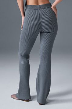 Crafted from soft, structured, ribbed-knit fabric inspired by the nuanced texture of denim, these form-fitting pants are designed with a substantial ribbed texture that subtly stands out. They’re finished with a universally flattering flared leg, and even better paired with the Denim Knit Garter Tank. Ribbed Stretch Wide Leg Bottoms, Fitted Ribbed Wide Leg Bottoms, Ribbed Stretch Straight Leg Bottoms, Alo Yoga Stretch Bottoms For Loungewear, Stretch Alo Yoga Bottoms For Loungewear, Fall Ribbed Gray Bottoms, Solid Ribbed Full-length Bottoms, Stretch Ribbed Pants For Work, Full Length Ribbed Bottoms For Fall