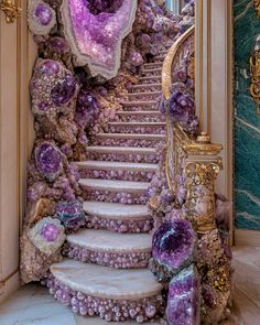 an elaborate staircase with purple and gold decorations