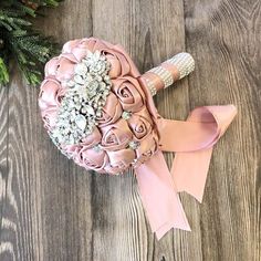 a bridal bouquet sitting on top of a wooden table