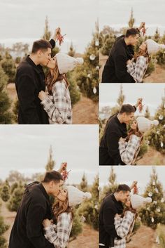 a man and woman kissing in front of trees