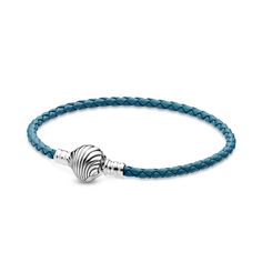 Add a pop of vibrant color to any of your outfits with the Pandora Moments Seashell Clasp Turquoise Braided Leather Bracelet. The turquoise leather’s intricate braid finishes in a sterling silver shell-shaped clasp that is inspired by the treasures of the deep and the colorful ropes used on sailboats. Wear it by itself for a splash of color or add ocean-themed Pandora Moments charms to customize your look. Turquoise Leather, Braided Leather Bracelet, Sailboats, Pandora Bracelet, Braided Leather, Pandora Jewelry, Pandora Charms, Color Splash, Turquoise Bracelet