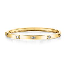 Indulge in opulence with our Fancy Shape Diamonds 18k Yellow Gold Hinged Bangle. Meticulously crafted, this bracelet features an exquisite array of fancy-shaped diamonds set in radiant 18k yellow gold. The hinged bangle design ensures a secure and comfortable fit, making it a versatile accessory for any occasion. Gold Diamond Bracelet With Brilliant And Baguette Cuts, Gold Diamond Bracelet With Baguette And Brilliant Cut, Gold Baguette Cut Diamond Bracelet With Accents, Yellow Gold Bangle With Baguette Diamonds For Wedding, Gold Diamond Bracelet With Baguette Cut, Yellow Gold Baguette Cut Bangle For Wedding, Gold Marquise Diamond Bracelet For Anniversary, Gold Bangle With Baguette Diamonds, Wedding Yellow Gold Bangle With Baguette Diamonds