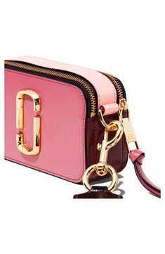 This compact handbag packs a major style punch with gleaming logo hardware and a statement-making strap. Whether worn crossbody or carried as a clutch, the sized-down style is an outfit-making must-have. Style Name:The Marc Jacobs The Snapshot Leather Crossbody Bag. Style Number: 5351361. Trendy Pink Bags With Logo Hardware, Trendy Pink Shoulder Bag With Logo Hardware, Pink Shoulder Bag With Logo Hardware For Travel, Pink Travel Shoulder Bag With Logo Hardware, Pink Shoulder Bag With Logo Hardware, Snapshot Bag, Purple Bags, Rebecca Minkoff Mac, Leather Crossbody Bag