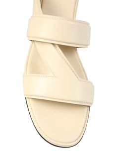 LAMELLED TRIANGULAR HEEL: 1.SIZE: ENGender: WomenColor: WHITEMade in: ITProduct ID: 651374_VBSL09031*Import tax/duty will be calculated at checkout (If applicable) Cream Slip-on Sandals With Leather Sole, Cream Sandals With Heel Strap And Flat Heel, Cream Flat Heel Sandals With Heel Strap, Classic Cream Sandals With Leather Sole, Cream Leather Sole Slip-on Sandals, Classic Cream Leather Sandals, Cream Sandals With Leather Sole And Flat Heel, Modern Cream Sandals For Formal Occasions, Classic Beige Sandals With Padded Heel