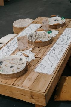 several plates and bowls on a wooden table