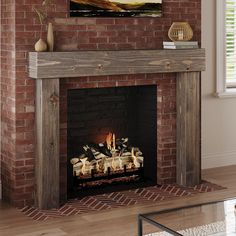 a fire place with a painting on the wall