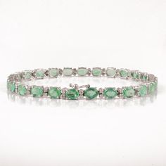 This is a classic style tennis bracelet. A must-have statement piece for every woman. It's a classic luxury to have. A perfect gift for your loved ones.-Material - Solid 18K White Gold -Gemstone -  Guanine Emeralds & Diamonds-Gemstone Weight - 8.070 ct-Diamond Weight - 0.410 ct-Gross weight - 8.75 gramsYou can also go to my shop Home for more similar bracelets: https://www.etsy.com/in-en/shop/Silver AppealWe offer free resizing, and any customization is welcome.A satisfied customer is our to Luxury Green Diamond-accented Tennis Bracelet, Promise Bracelet, Bracelet Tennis, 18k Gold Bracelet, Emerald Bracelet, Birthstone Bracelet, Dainty Bracelet, Bracelet Dainty, May Birthstone