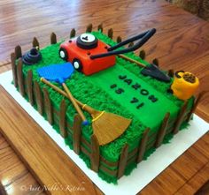 a birthday cake that is shaped like a lawnmower