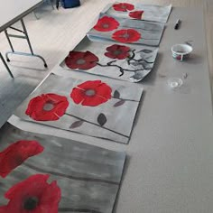 the rugs on the floor are made to look like poppies in red and grey