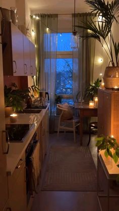 a kitchen filled with lots of counter top space next to a dining room table and chairs