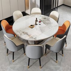 a marble dining table with six chairs around it and bottles on the table in front of them