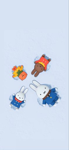 four small animal magnets in the shape of rabbits, carrots and other animals