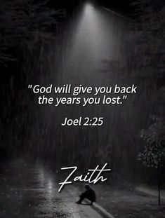 a person kneeling in the rain under a street light with a bible quote above it