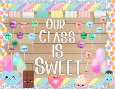 a sign that says our class is sweet with some candies and lollipops