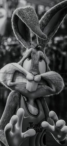 a cartoon rabbit is wearing a basketball uniform and holding his hands out to the side