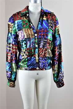 "Love love love this one...the colors..the sparkles...great for any season..and great for any party!! Talk about standing out!! This is a standout!! This is a bomber style, yet can be used as a formal piece..amazing look There is some color loss on the sequins, but frankly i didnt even see it at first because under the colors are silver..so it does not affect look at all. This is in Very Good condition Measuring: 24\" length Width: 46\" Sleeves: 24\" Pet Free/smoke free Enjoy!" Spring Party Outerwear With Patchwork, Multicolor Sequined Outerwear For Fall, Multicolor Sequined Outerwear For Party Season, Multicolor Sequined Party Outerwear, Party Multicolor Sequined Outerwear, Trendy Multicolor Sequined Outerwear, Fitted Multicolor Sequined Outerwear, Embellished Multicolor Party Outerwear, Multicolor Embellished Party Outerwear