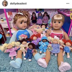 there are many dolls sitting on the floor