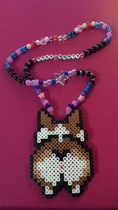 a beaded necklace with a dog on it