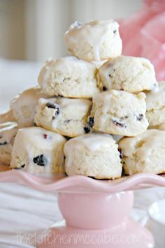 a pile of cookies sitting on top of a pink plate