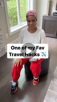 a woman sitting on top of a bean bag chair in front of a window with the words, one of my fav travel hacks