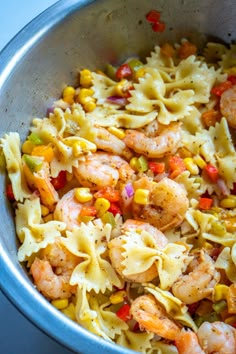 pasta with shrimp and vegetables in a pan