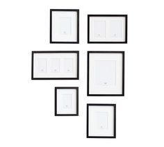 four black and white framed pictures hanging on the wall