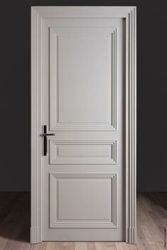 an open white door on a wooden floor