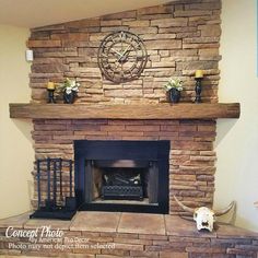 a stone fireplace with a clock on the mantle