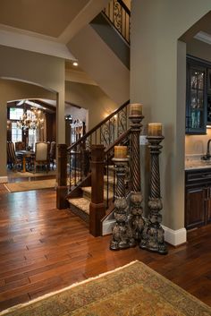 the stairs in this house have candles on them and there is also a chandelier