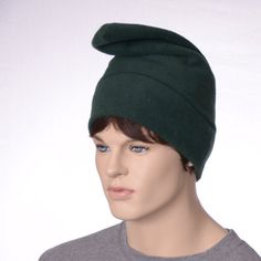 Simple dark green Phrygian cap hat made of fleece. This hat is made from a lightweight fleece fabric. Made so the hat points forward. Point can be pull up or folded forward. Machine washable. Fits heads measuring 22-24 inches MG001977 Green Brimmed Winter Costume Hats, Green Winter Costume Hats And Headpieces, Green Windproof Cap, Phrygian Cap, Hat Cosplay, Elf Gnome, Green Elf, Gnome Hat, Costume Hats