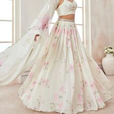 Stunning White Floral Lehenga With Stitched Blouse. White Silk Summer Sets, Fitted Silk Sets In Off White, Fitted Off White Silk Set, Elegant Summer Wedding Lehenga, Elegant Summer Floral Print Lehenga, White Feminine Sets For Spring, Feminine Floral Print Wedding Sets, Elegant Off White Sets For Spring, Elegant Summer Lehenga With Floral Print