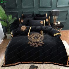 black and gold versa bedding set with lion head on the front, in an elegant bedroom