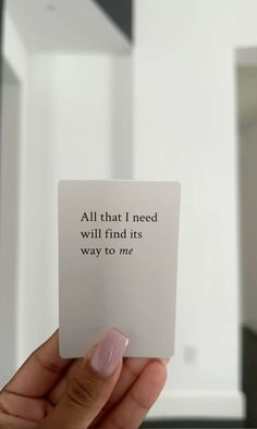 someone holding up a card that says, all that i need will find its way to me