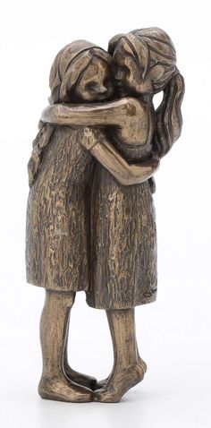 a statue of two people hugging each other