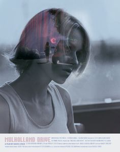 a woman sitting in front of a window with her reflection on the wall behind her