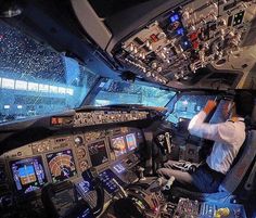 a man sitting in the cockpit of an airplane