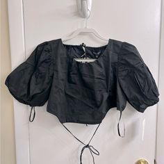 For Love & Lemons Joanna Crop Top In Black “Playful Cotton Poplin Crop Top Featuring Pretty Paneled Puff Sleeves And A Dramatic Open Back With Delicate Drawstrings.” - Women’s Size Large - Paneled Puff Sleeves - Open Back With Strappy Drawstrings - Functional Ties Along Back - Fully Lined - Nwt Black Puff Sleeve Top For Summer, Fitted Black Puff Sleeve Top For Summer, Black Cotton Puff Sleeve Top For Spring, Black Puff Sleeve Crop Top For Spring, Black Puff Sleeve Top For Summer Night Out, Black Puff Sleeve Top For Night Out In Summer, Black Puff Sleeve Top For Summer Nights, Black Cotton Puff Sleeve Top For Summer, Black Puff Sleeve Crop Top For Night Out