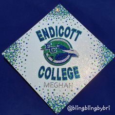 a badge that says endicott college meghan on it with blue and green dots