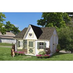 a dog standing in front of a small house