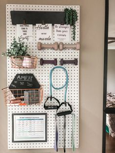 a peg board with several items hanging on it