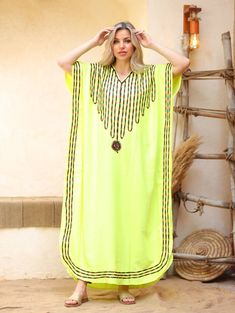 An elegant and stylish caftan will make you feel like African royalty. It's extremely elegant with a dash of colorful cotton embroidery adorning the kaftan. Ideal for plus size women as well. Made of extremely soft fabric to make you feel free and beautiful at the same time.  This Kaftan is ideal to wear for any casual occasion. Whether taking a trip down the shopping lane, or home-based kitty parties, or about anything else, wearing this dress will make you feel classy and comfortable. Fabric : Green Free Size Festival Kaftan, Green Kaftan For Vacation And Eid, Green Kaftan For Eid Vacation, Embroidered Green Kaftan, Traditional Green Free Size Kaftan, Green V-neck Abaya, Yellow Embroidered Summer Kaftan, Green Long Thobe For Beach, Bohemian Green V-neck Abaya