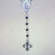 "Inspired by Yolanda Foster Rosary on The Real Housewives of Beverly Hills - shown in Black crystal and silver. This listing is for a custom made rosary necklace 20\" long (excluding the drop) made with Swarovski 4mm pearls or crystals in your choice of color. You will have your choice or gold or silver findings including the cross and center connector. Each rosary is 4 decades plus the drop and has a lobster clasp and a 3\" extension. Can also be made as an Anglican or Jewish rosary. Convo me f Silver Necklace With Miraculous Medal For Wedding, Silver Necklace With Miraculous Medal For Jewelry Making, Silver Cross Jewelry With Miraculous Medal, Silver Miraculous Medal Jewelry For Wedding, Sterling Silver Crucifix Jewelry For Wedding, Silver Miraculous Medal For Wedding, Silver Crystal Spiritual Jewelry, Silver Jewelry With Miraculous Medal For Gift, Silver Crystal Crucifix Jewelry