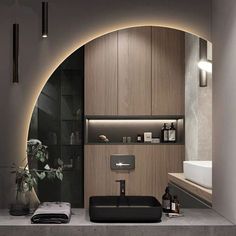 a modern bathroom with wooden cabinets and lighting