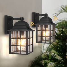 two black outdoor lights on a wall