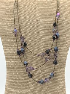 Multi strand purple beads necklace by Lia Sophia Purple Beaded Necklace With Round Black Beads, Adjustable Purple Necklace With Black Beads, Purple Beaded Chain Necklace, Purple Beaded Necklace With Black Beads For Gift, Elegant Adjustable Purple Beaded Necklaces, Purple Single Strand Beaded Necklace, Purple Necklace With Black Beads For Gift, Elegant Adjustable Purple Beaded Necklace, Purple Necklaces With Dangling Beads