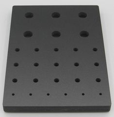 a black square with holes on it