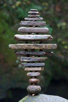 a stack of rocks sitting on top of a rock