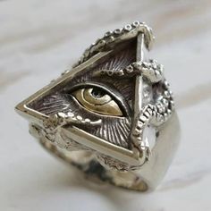 Huge Illuminati Eye Triangle Silver Unique Ring Details: - Condition: New - Metal: Copper - Band Color: Silver - Included: 1 X Ring Check Out My Other Listings! Other Items I Carry: Vintage Rings Retro Rings Men's Rings Sterling Silver Rings Engagement Bridal Wedding Rings Punk Biker Rings Ethnic Rings Floral Rings Pearl Rings Art Deco Rings Gothic Rings Couples Rings Ring Sets Heart Rings Funny Rings Silver Necklaces Gold Necklaces Vintage Necklaces And Earrings Handmade Jewelry Opal Rings Bracelets And Necklaces And Tons Of Popular Trendy Jewelry Deals. Masonic Rings Jewelry, The Eye Of Horus, Vintage Octopus, Ring Man, Biker Jewelry, Masonic Ring, Biker Rings, Retro Ring, Seeing Eye